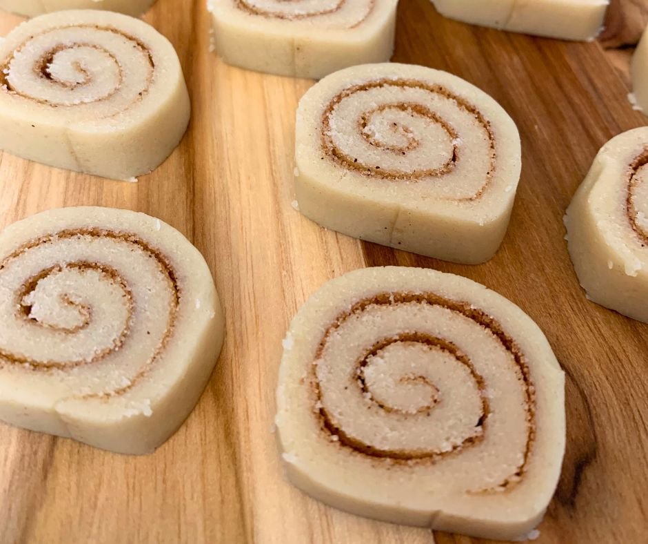 cinnamon roll cookie dough rolled up and ready to be baked