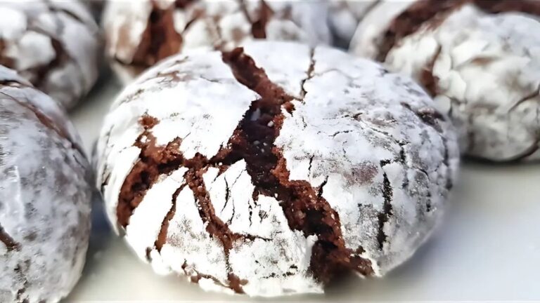 Fudgy chocolate crinkle biscuits with a crackled top, ideal for festive baking and making snowball cookies for Christmas