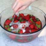 Washing Strawberries in a bowl