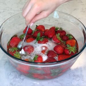 Washing Strawberries in a bowl