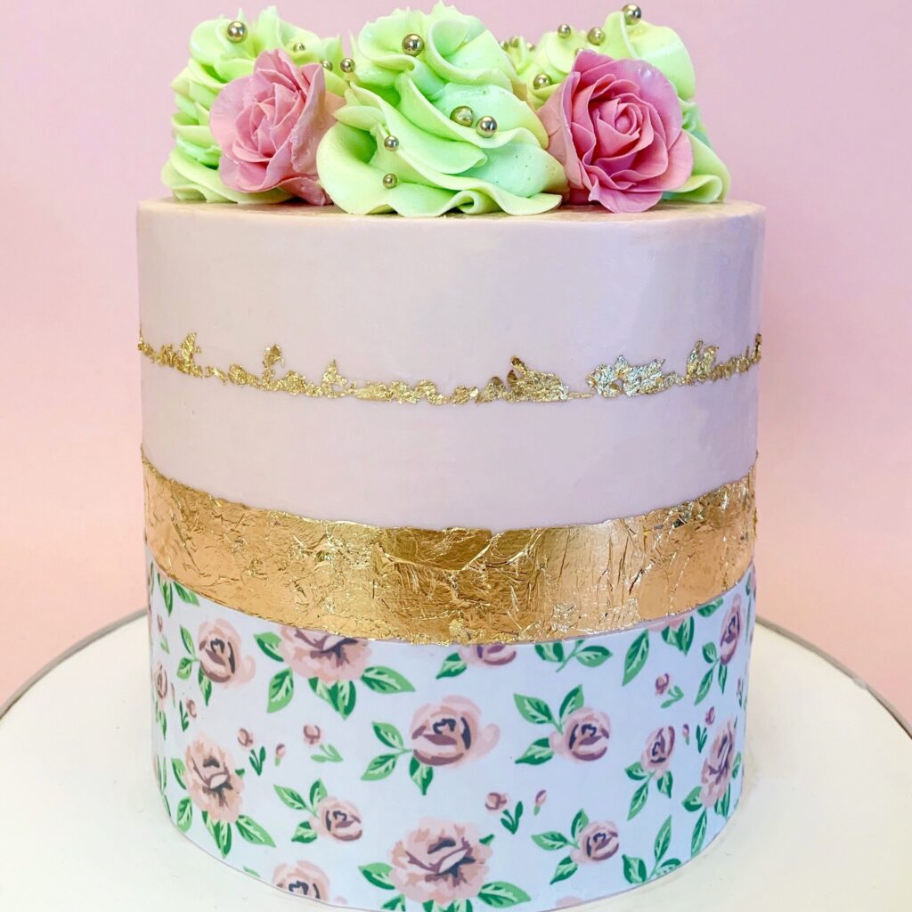 Pink flower cake on display with pink background