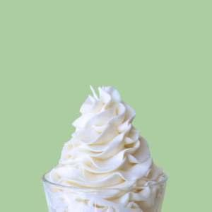 image showing buttercream frosting in a cup to show how to make super white buttercream