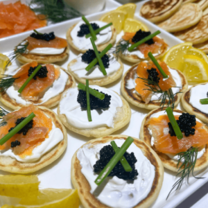 smoked salmon blinis on a platter