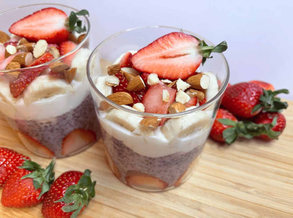 No-bake strawberry banana chia seed pudding in a jar, topped with fruit
