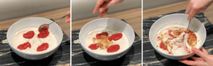 Adding crushed digestive cookies and strawberry jam into the ice cream mixture before freezing