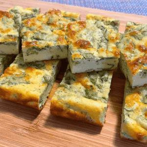 cottage cheese egg bite squares on a wooden board