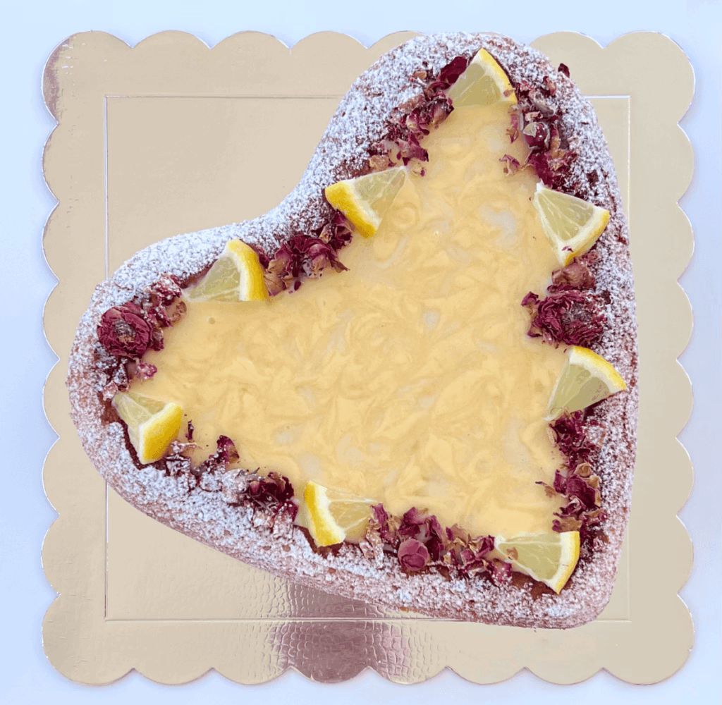Heart-shaped cake with lemon curd filling in the center, no buttercream