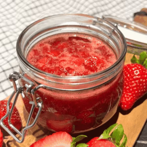 close up of homemade strawberry jam recipe in a jar