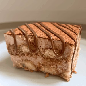 slice of tiramisu nutella in a plate with a drizzle of nutella on top