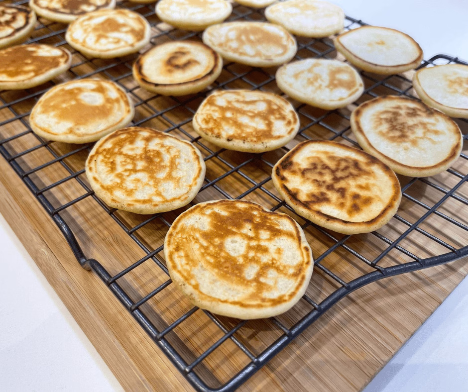 easy blinis recipe set to cool on a rack