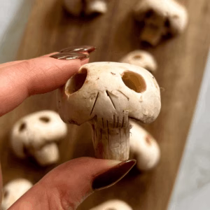 Carved skeleton head mushrooms Halloween food idea