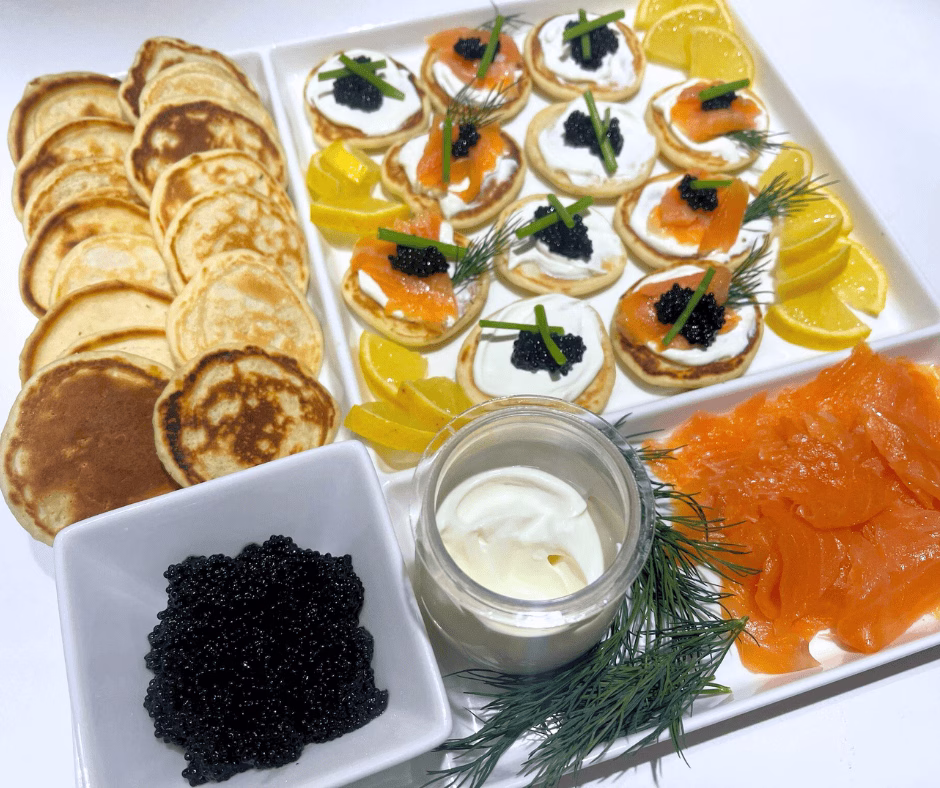 salmon blinis arranged for Christmas appetizer