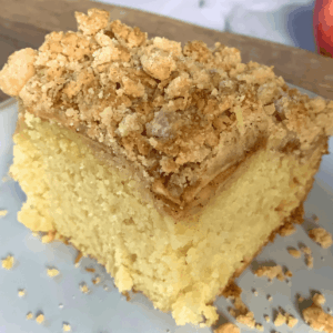 slice of apple crumble cake on a plate