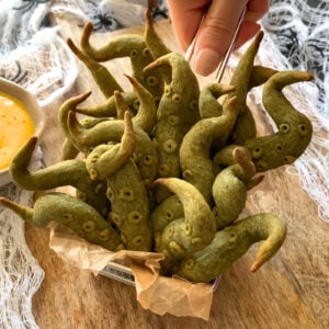 Close-up of baked sweet potato tentacles showing crispy edges and texture, a fun Halloween party food.