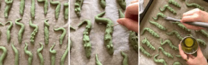 Sweet potato tentacles brushed with olive oil on a baking tray ready for the oven, spooky Halloween snack.