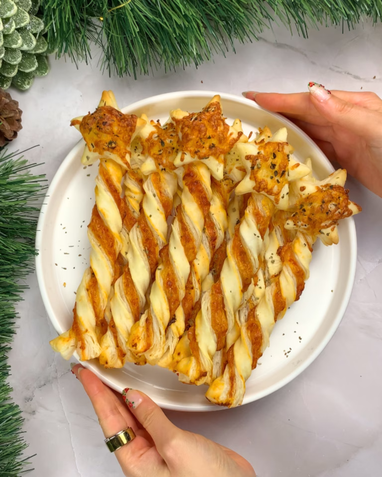 puff pastry christmas appetizers that look like magic wands and are filled like pizza