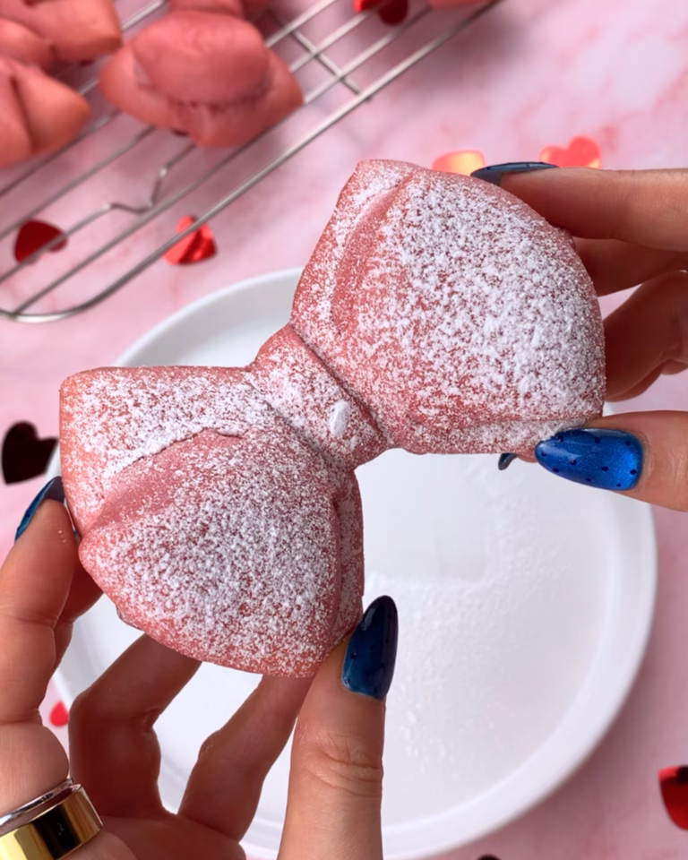 soft pink bow brioches dusted with powdered sugar, perfect for a Valentine's Day brunch